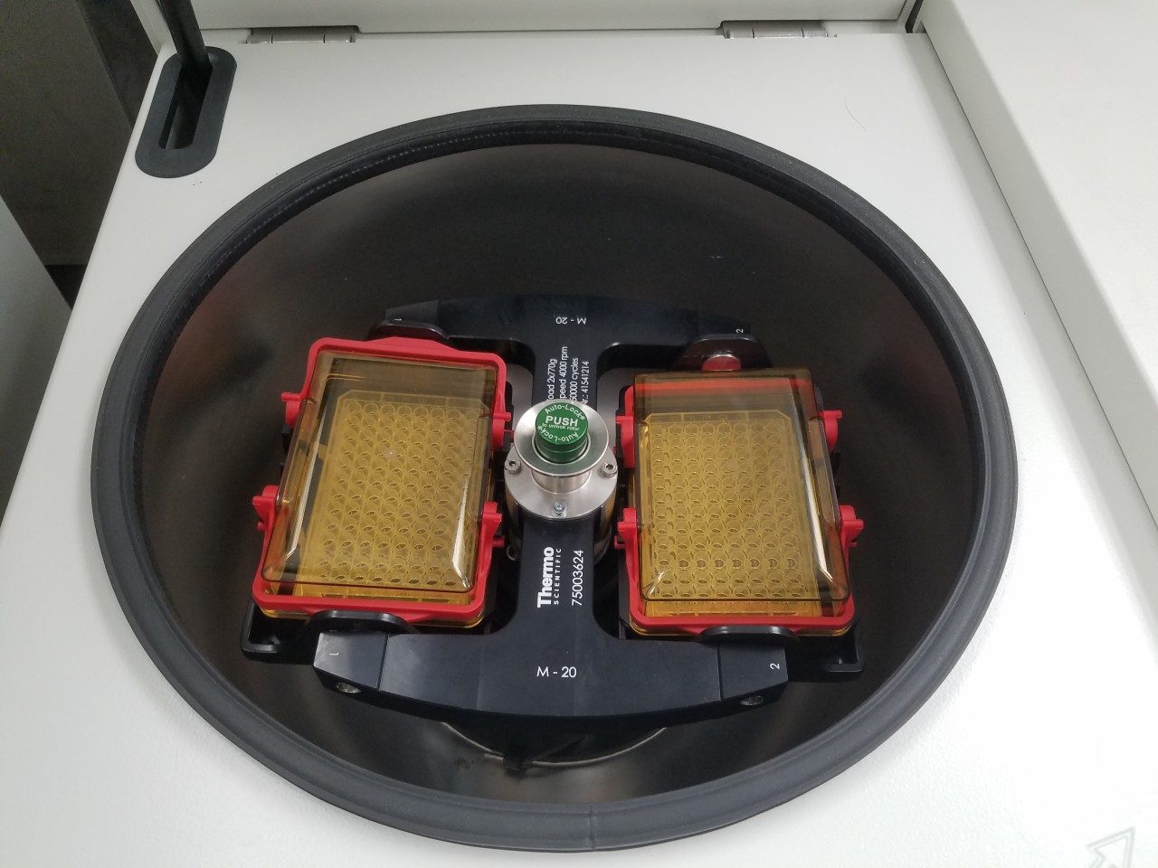 Photo of tabletop centrifuge with sealed microplate rotors